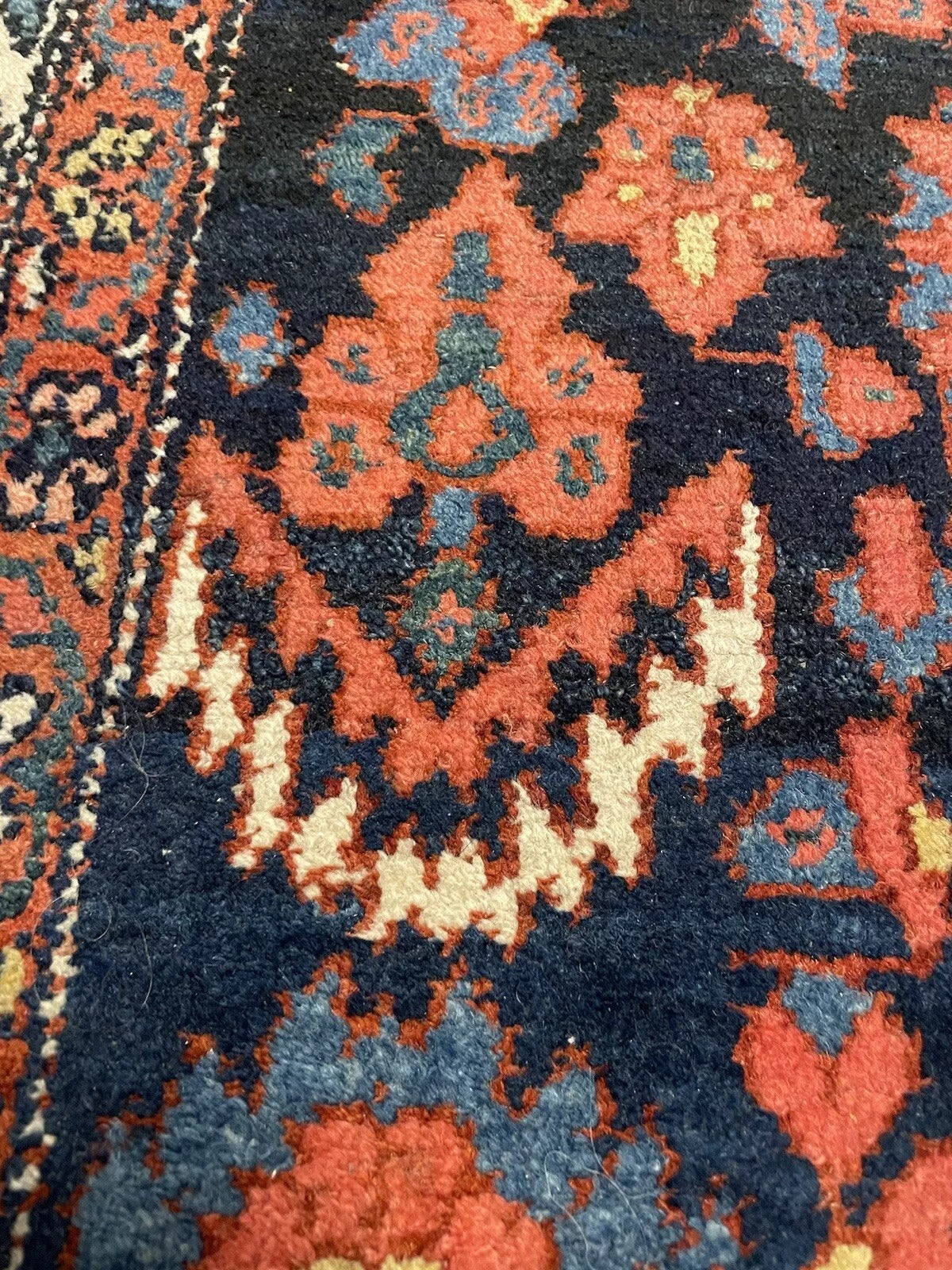 Persian-style Bakhtiari rug featuring striking central motifs
