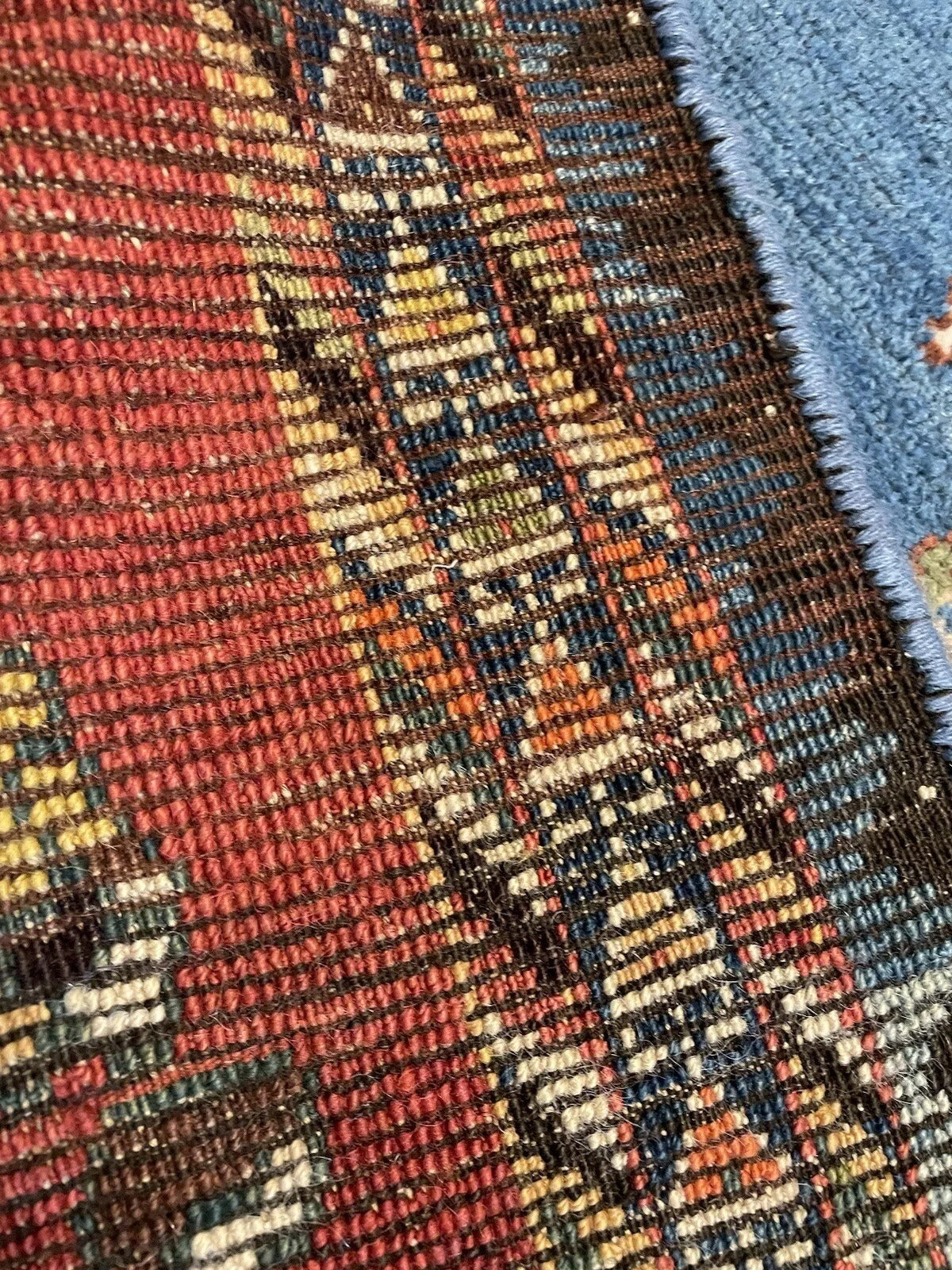 Close-up of central lion motif on an antique Gabbeh rug
