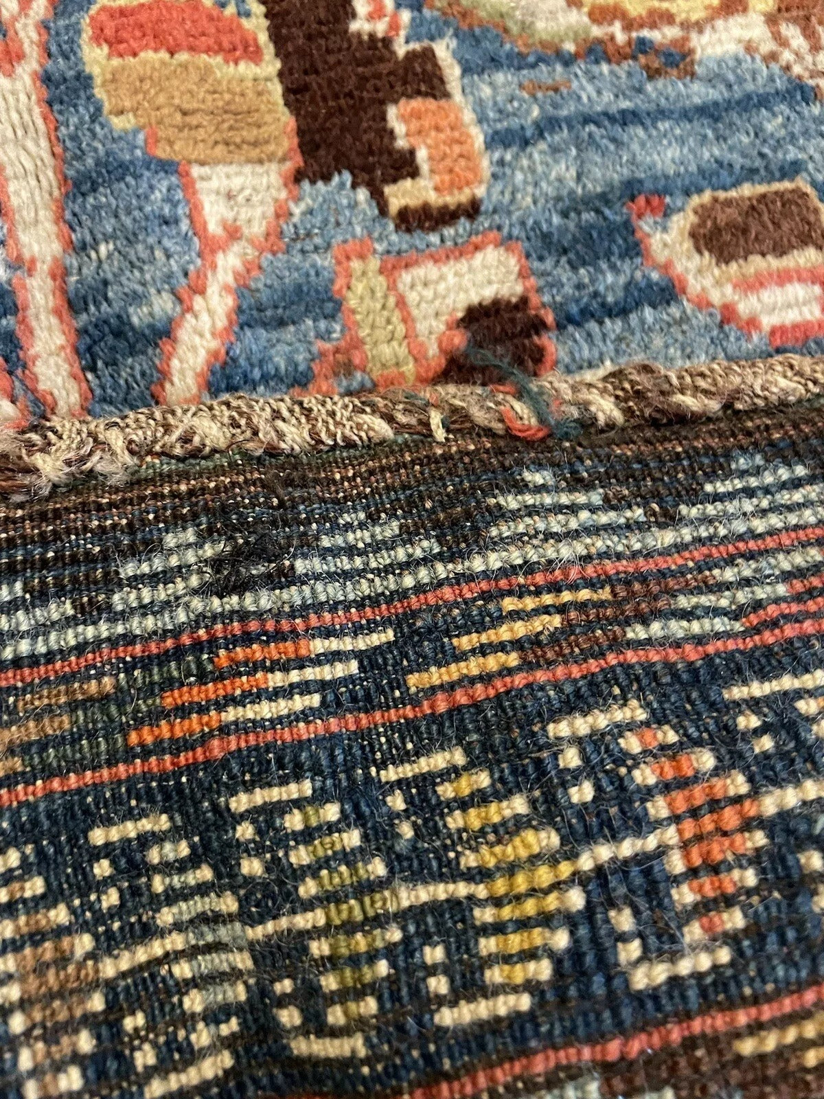 Bold and vibrant color palette of a 1910s Gabbeh rug
