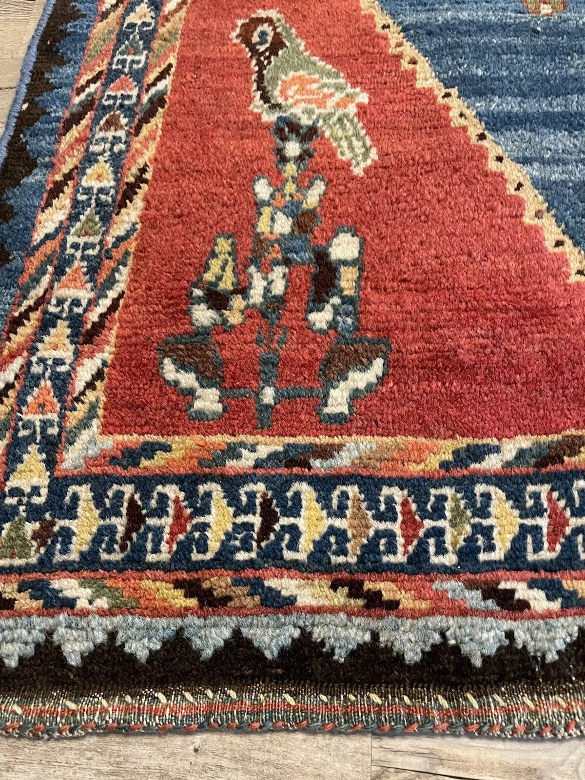 Detailed border pattern on a vintage Gabbeh rug
