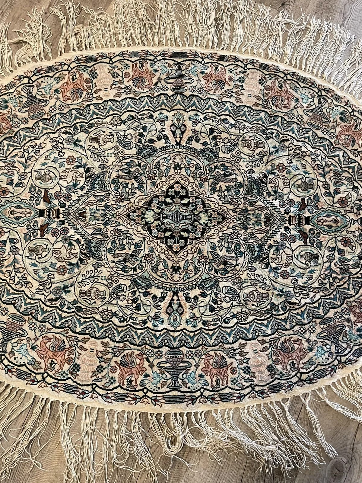 Close-up of intricate floral motifs on a vintage silk-on-silk rug
