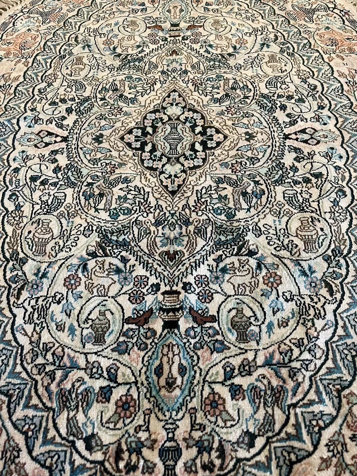 Authentic vintage silk rug with rich artistic heritage
