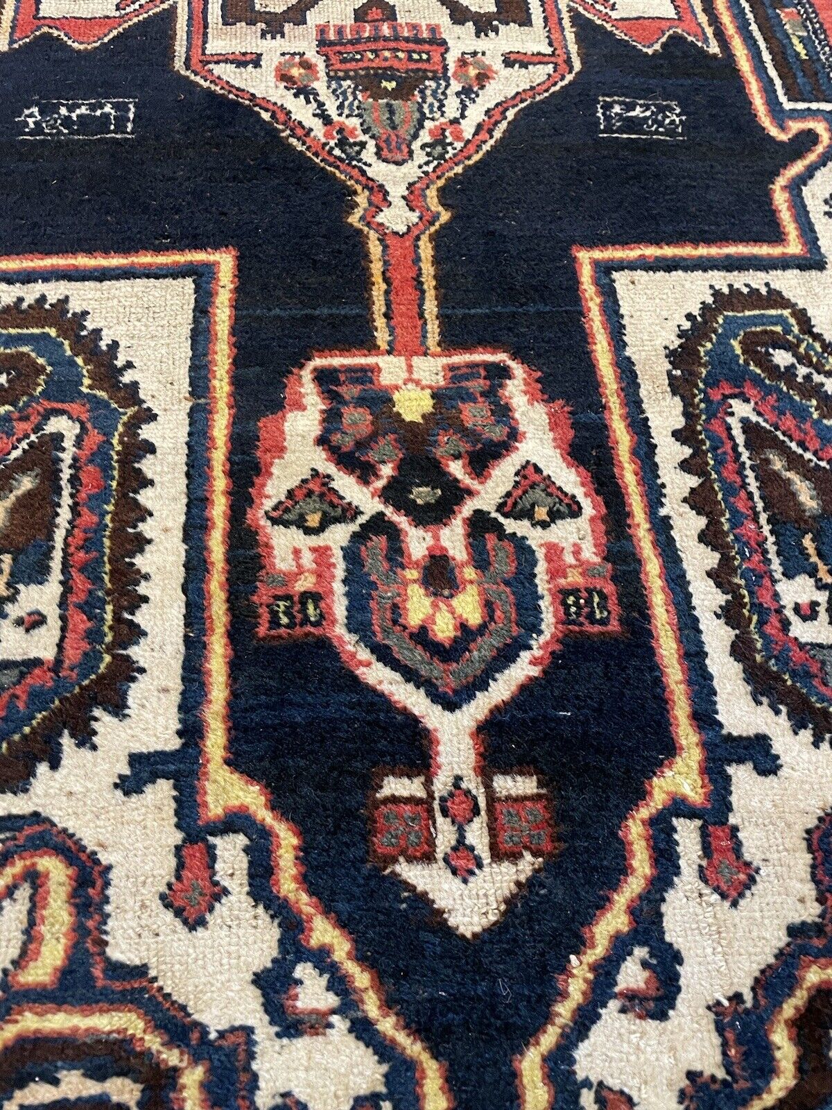 Handwoven wool rug featuring traditional Middle Eastern craftsmanship
