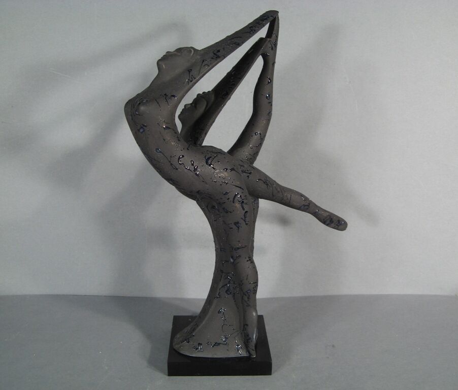 Vintage charm: Ceramic dancing couple sculpture with character.