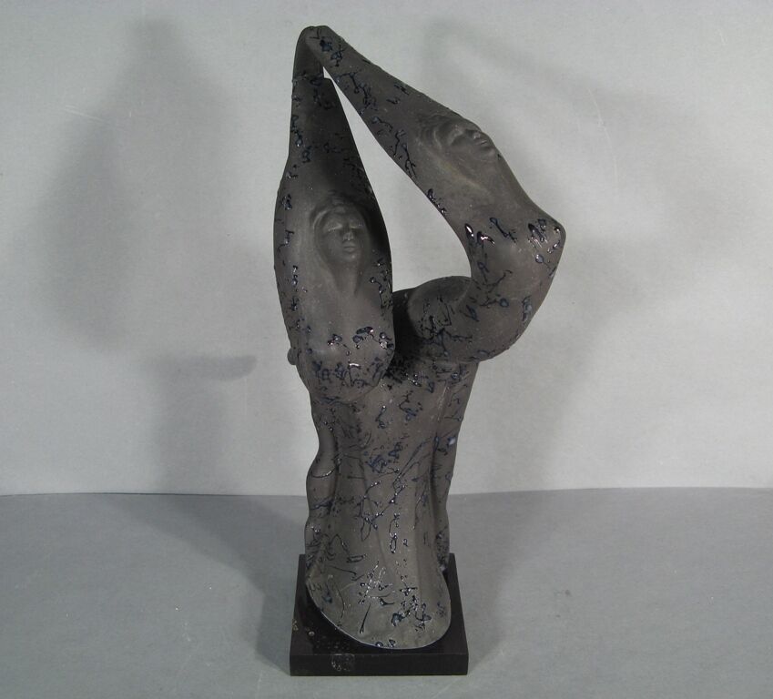 Collectible ceramic masterpiece: A vintage sculpture depicting a graceful dance.