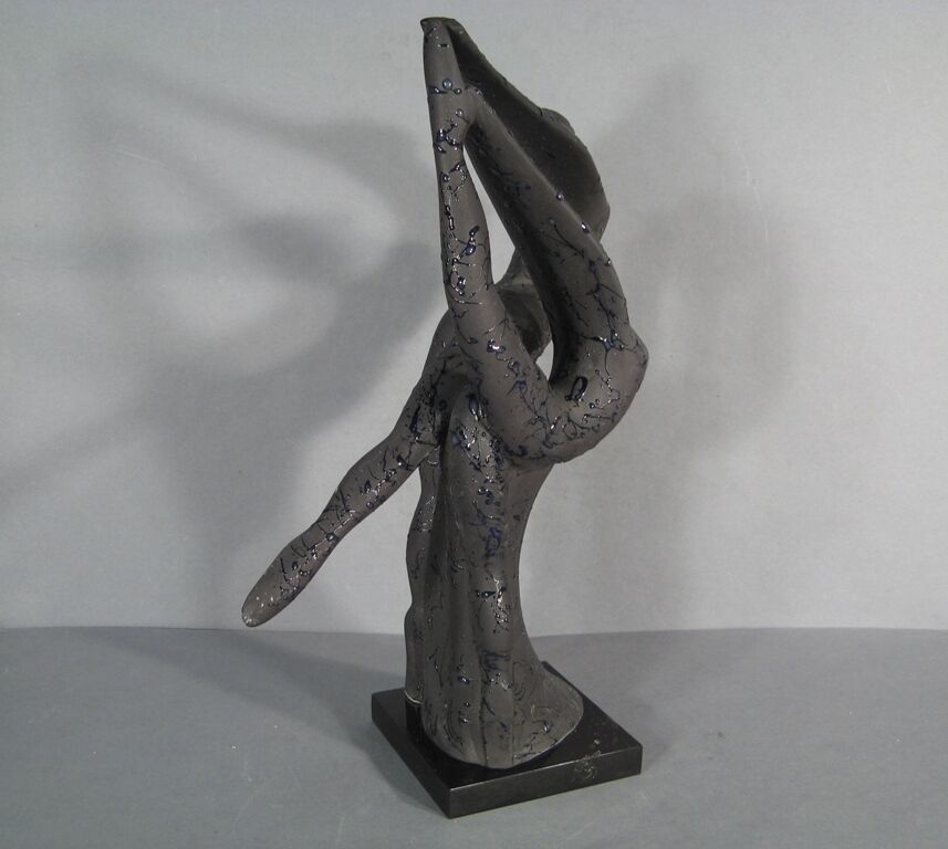 Enhance your home decor with this timeless ceramic dancing couple sculpture.