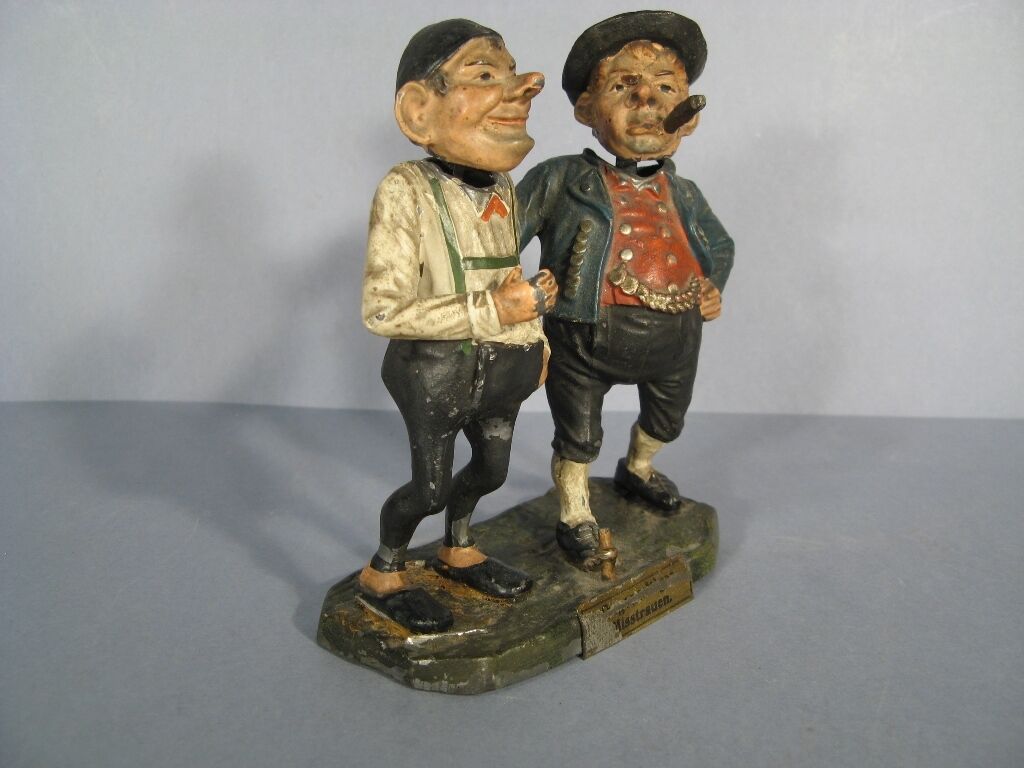 German folk art statue titled "Misstrauen" (Distrust).
