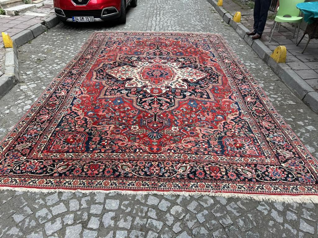 Handmade Antique Persian Bakhtiari Rug showcasing its regal red color palette and 