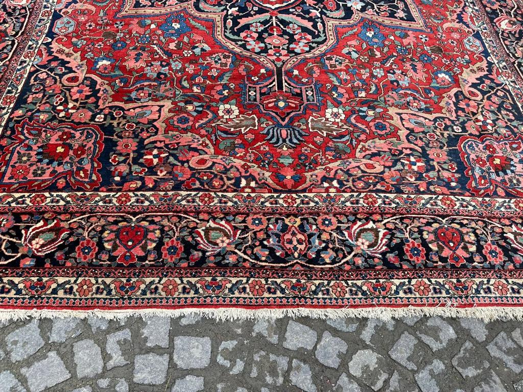 Close-up of the rug's traditional design and fine weave, highlighting the skill of the artisans