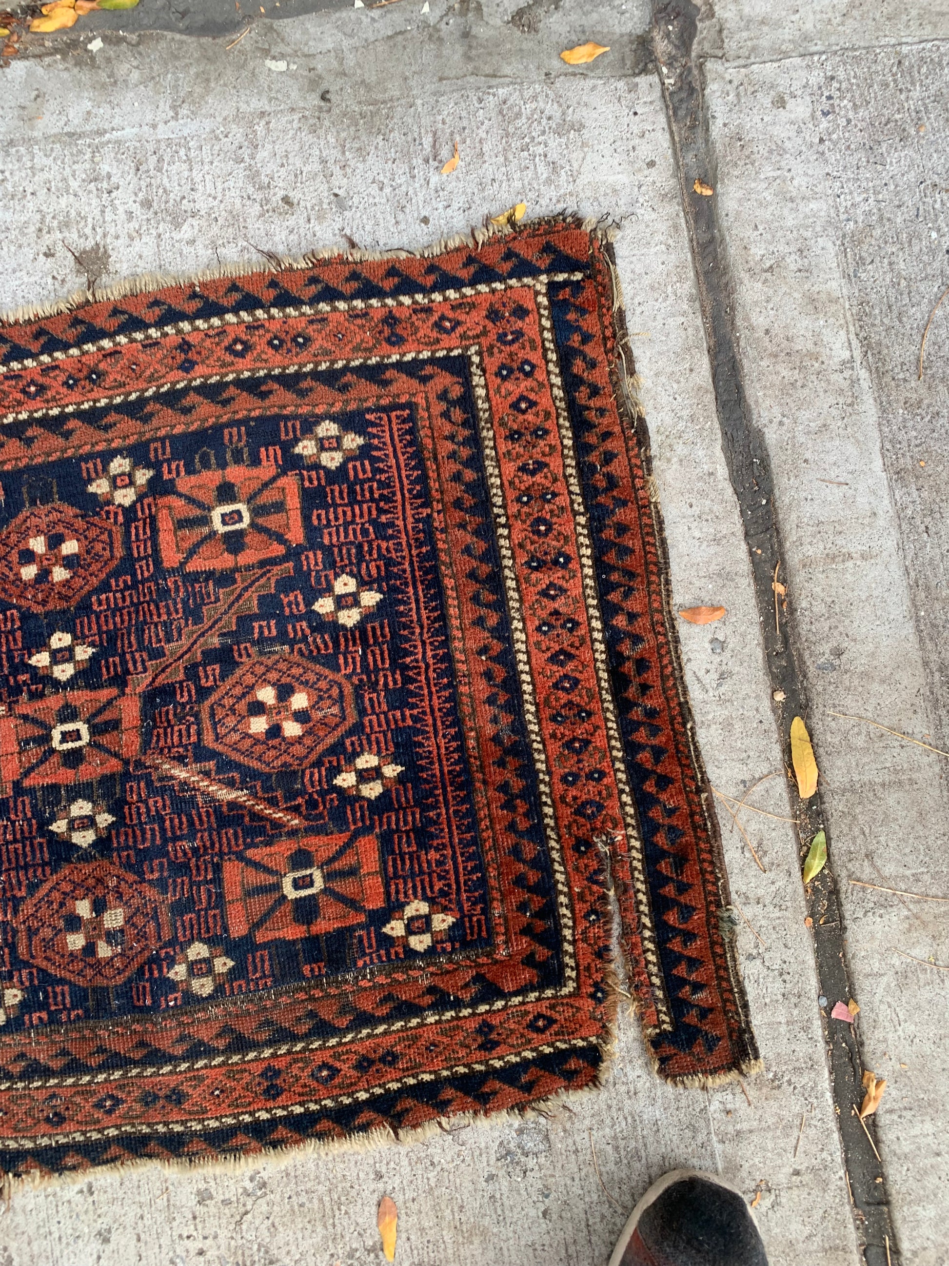 Afghan Baluch bagface with deep indigo and rusty red tones.
