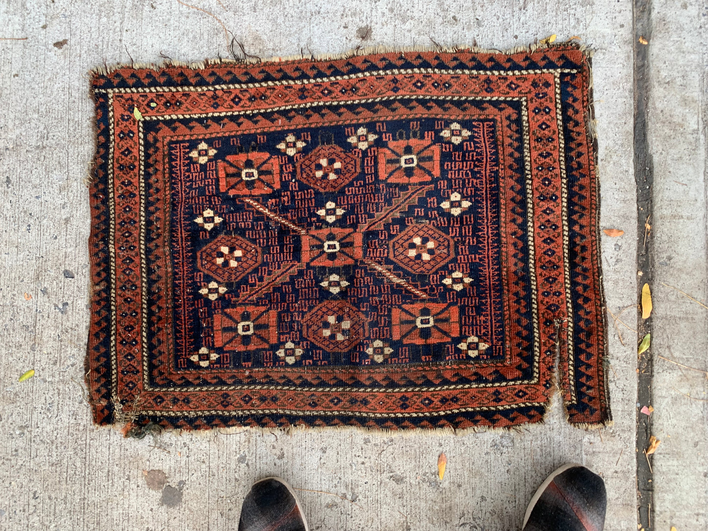 Handwoven wool bagface showcasing 19th-century Baluch artistry.
