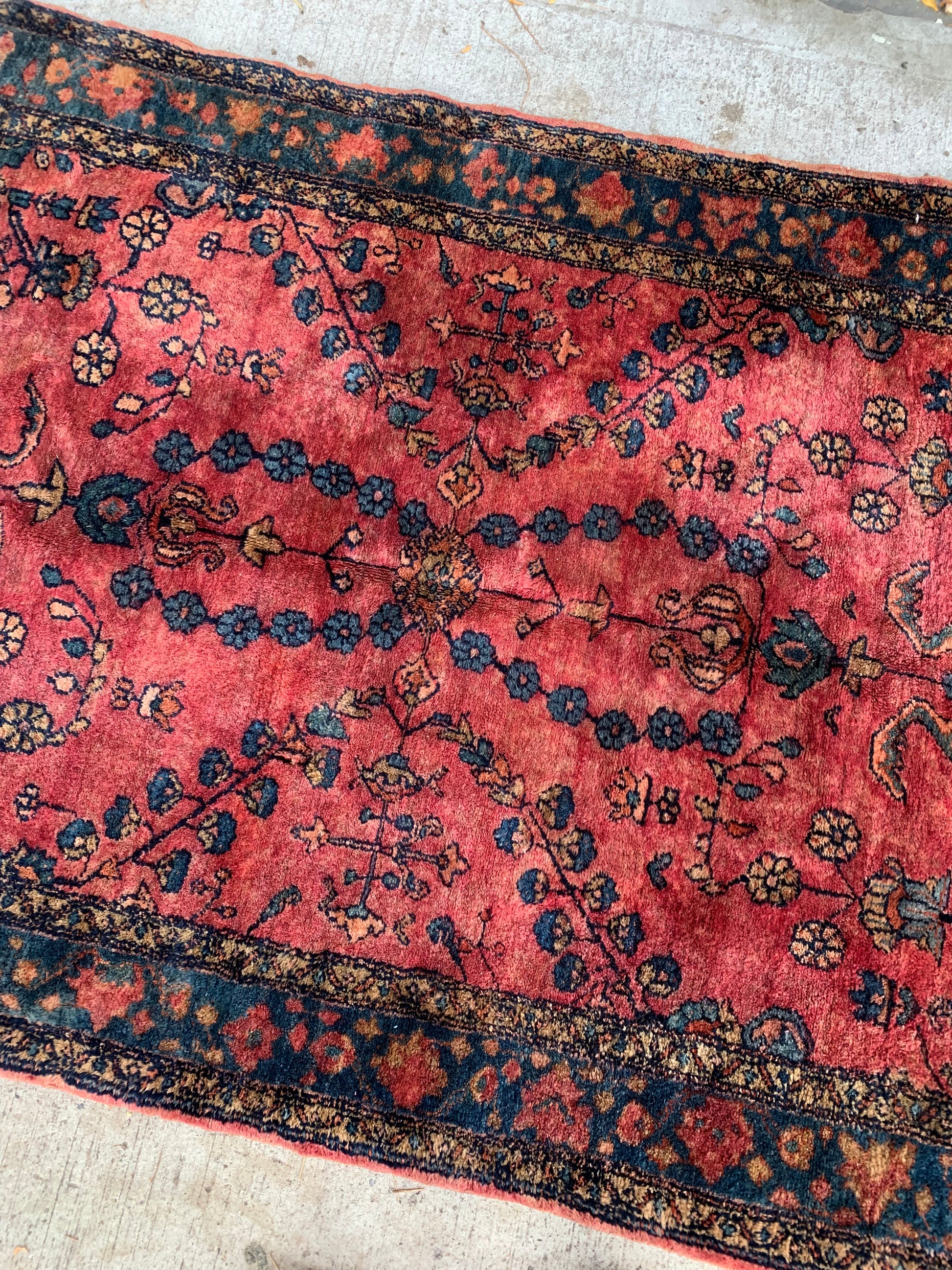 Close-up of the medallion-like floral pattern on a Lilihan rug.
