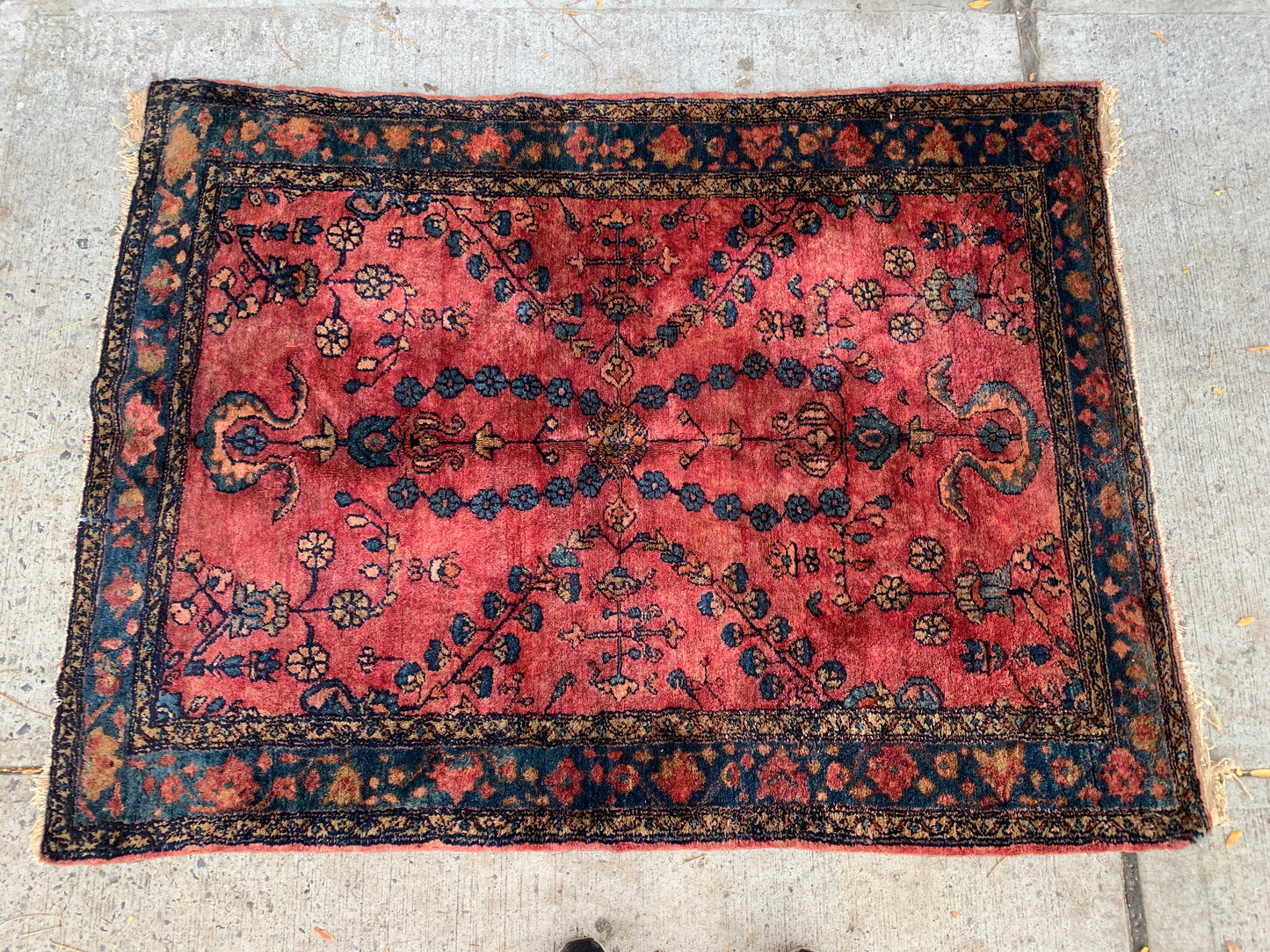 Handwoven Persian rug with natural dyes and intricate patterns.
