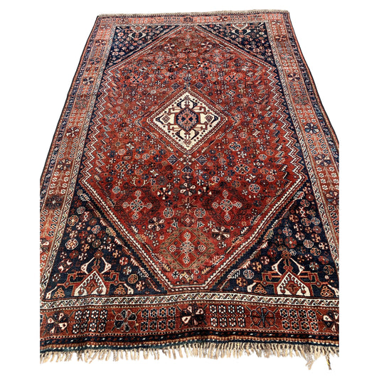 Handmade antique Persian Qashqai rug from the 1900s.
