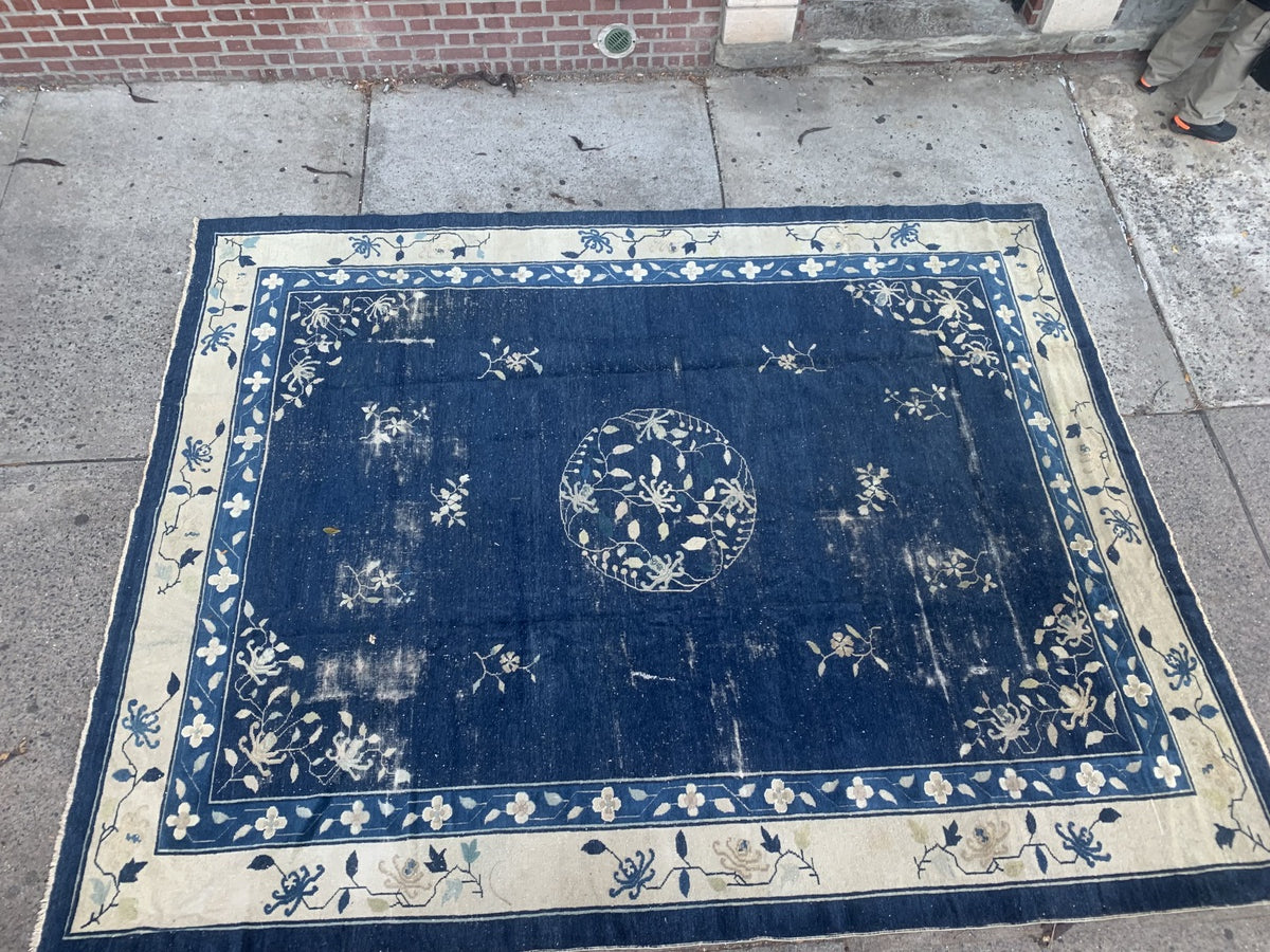 Large antique area rug perfect for living or dining spaces.
