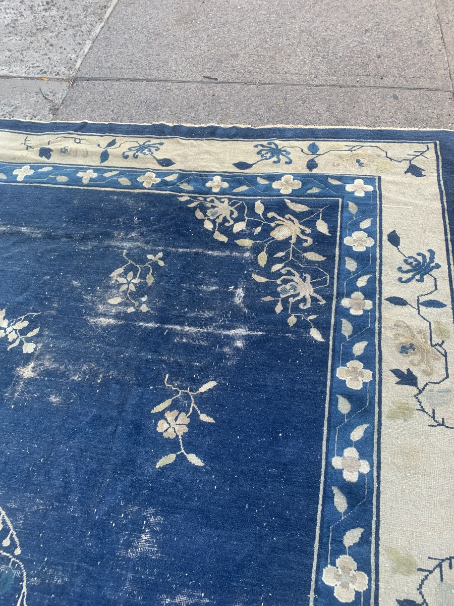 Corner detail of the floral border on a Chinese Peking rug.
