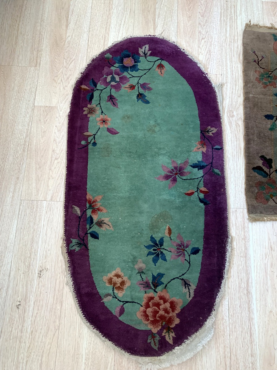 Small antique Chinese rug with green and purple Art Deco palette.
