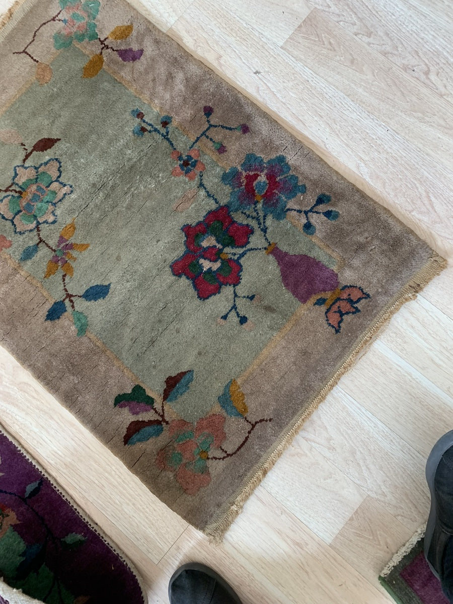 Edge detailing on the vintage hand-knotted Chinese wool rug.
