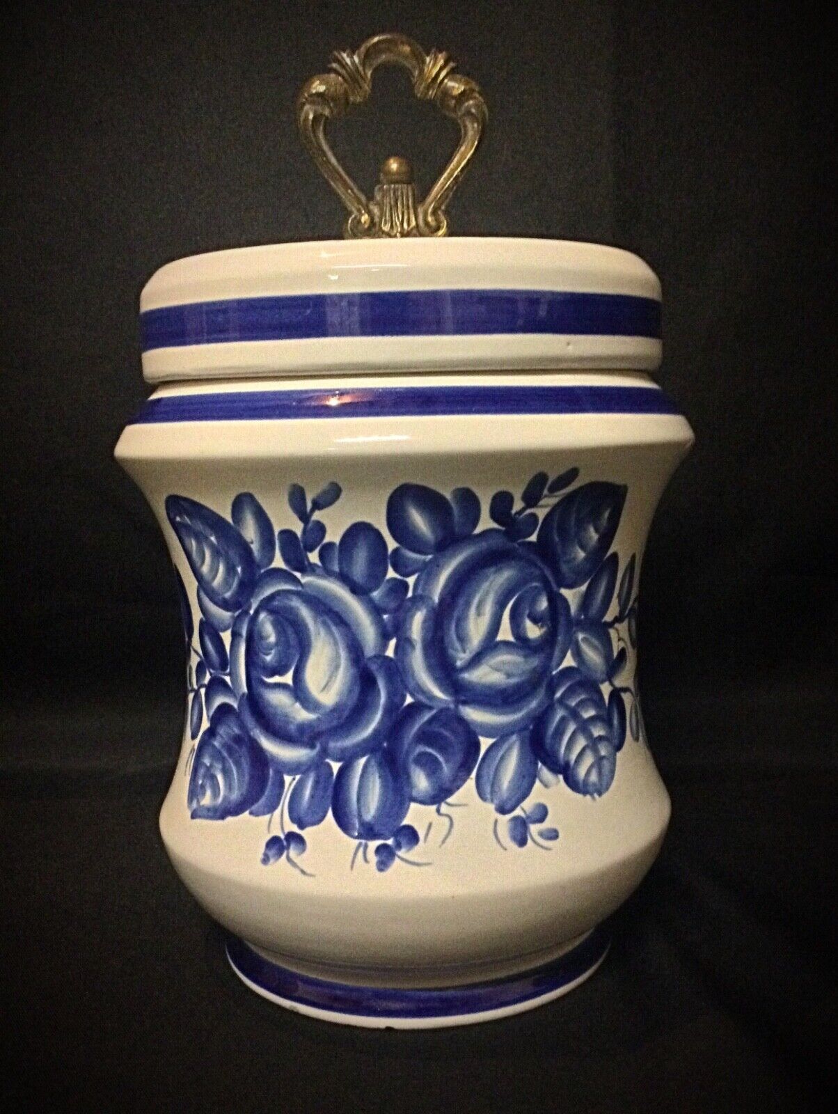 Close-up of blue floral design on Macabo urn
