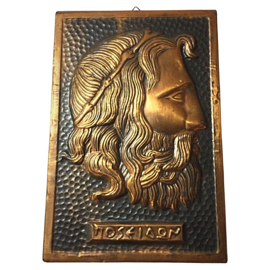 Vintage hammered copper bas-relief of Poseidon's head
