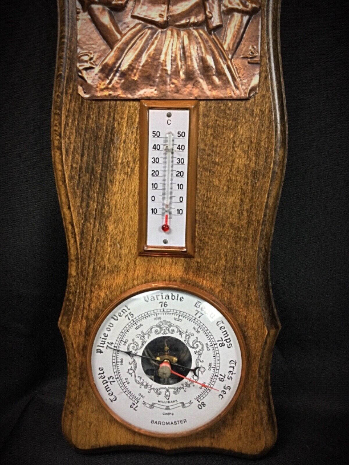 Elegant French barometer with artistic copper decoration
