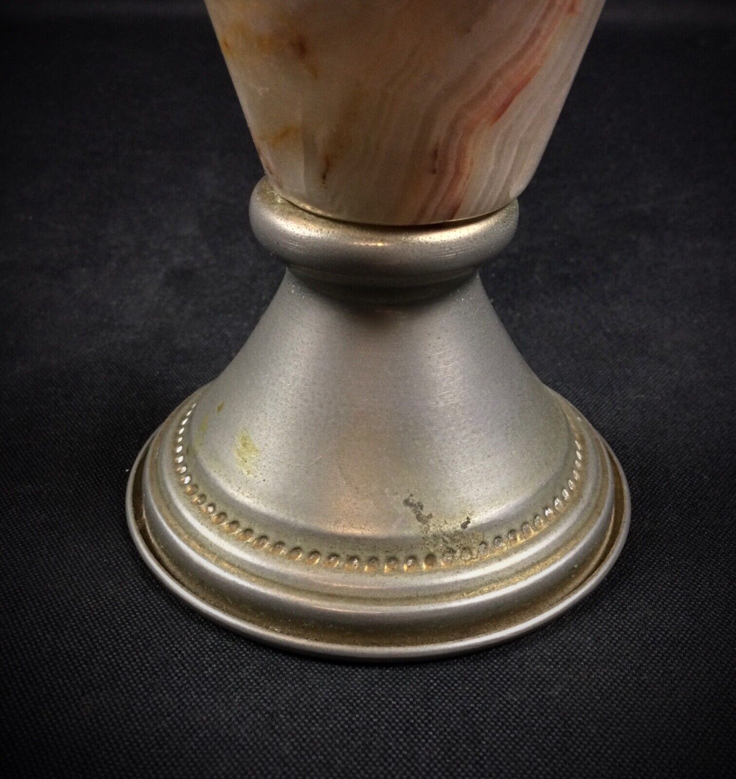 Top view of a small onyx and pewter jug vase, showcasing craftsmanship
