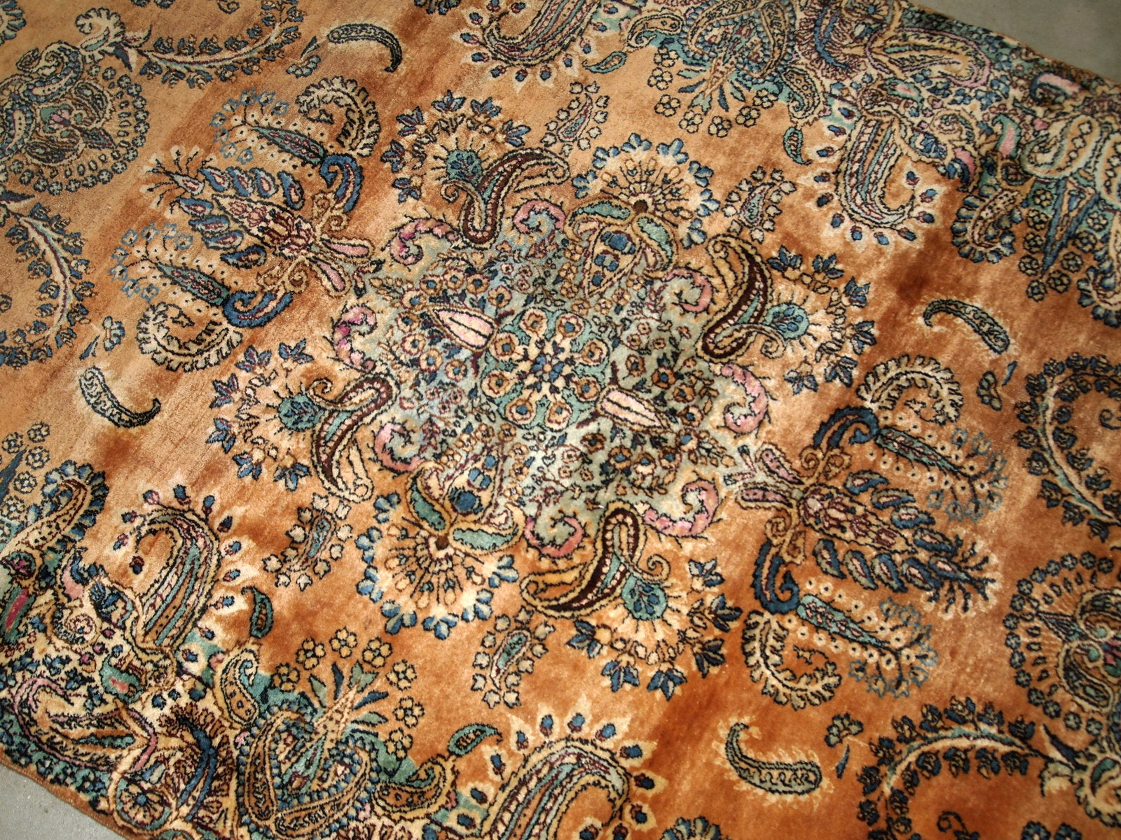 Antique hand-woven Kerman rug in original good condition. The rug is from the beginning of 20th century.