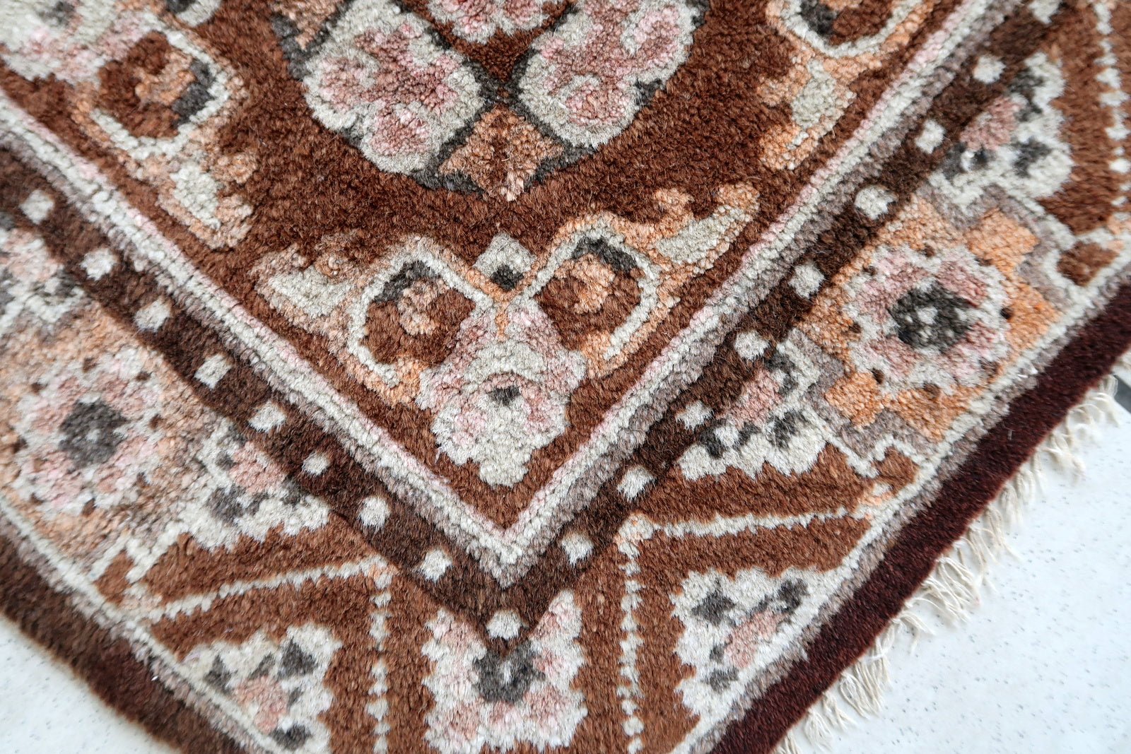 Handmade vintage Mongolian collectible mat in brown shade. The rug is from the middle of 20th century in original good condition.