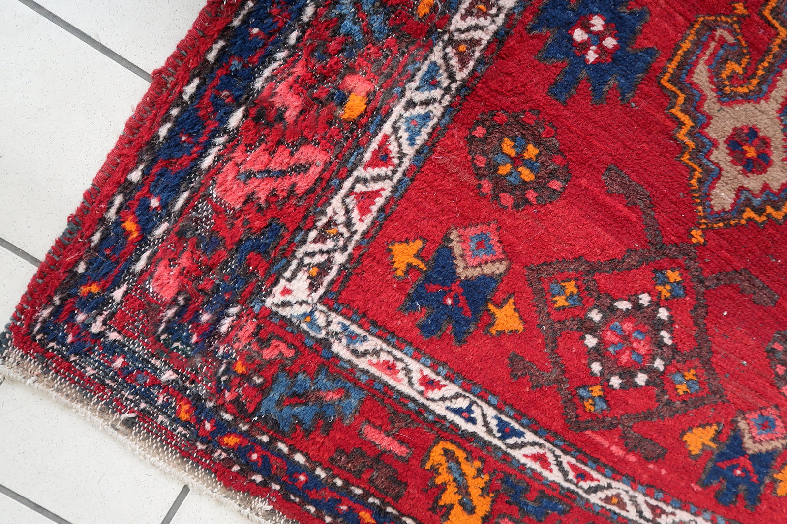 Handmade vintage Persian Hamadan rug in bright red color with large medallion. The rug is from the end of 20th century in original condition, it has some low pile.