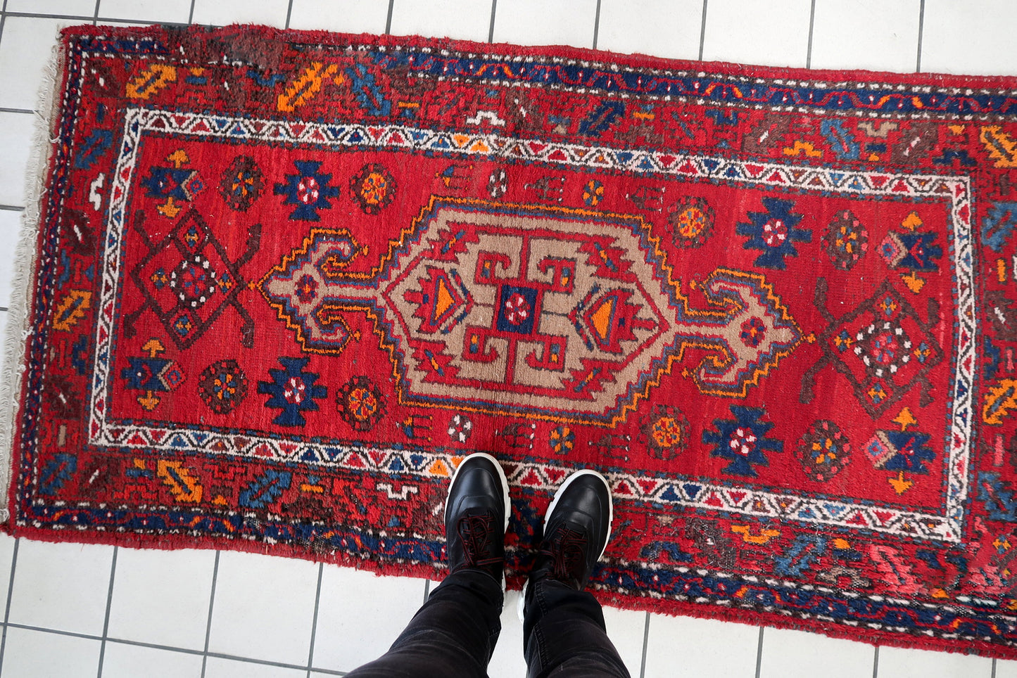 Handmade vintage Persian Hamadan rug in bright red color with large medallion. The rug is from the end of 20th century in original condition, it has some low pile.