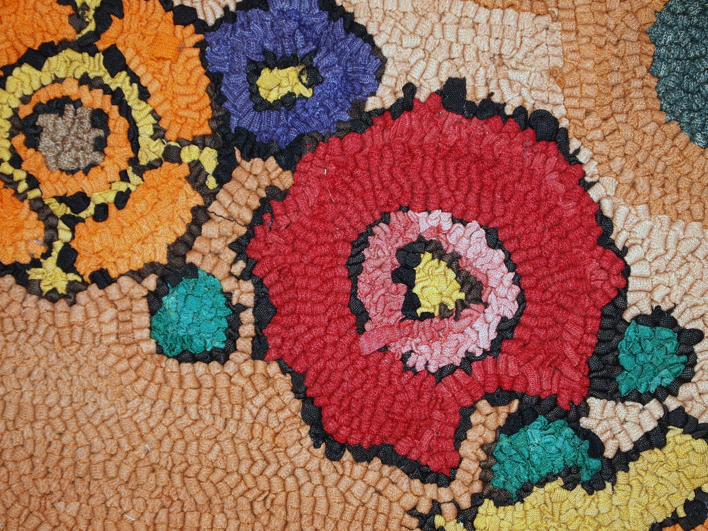 Rug backside detail showing the handcrafted quality of the American hooked rug