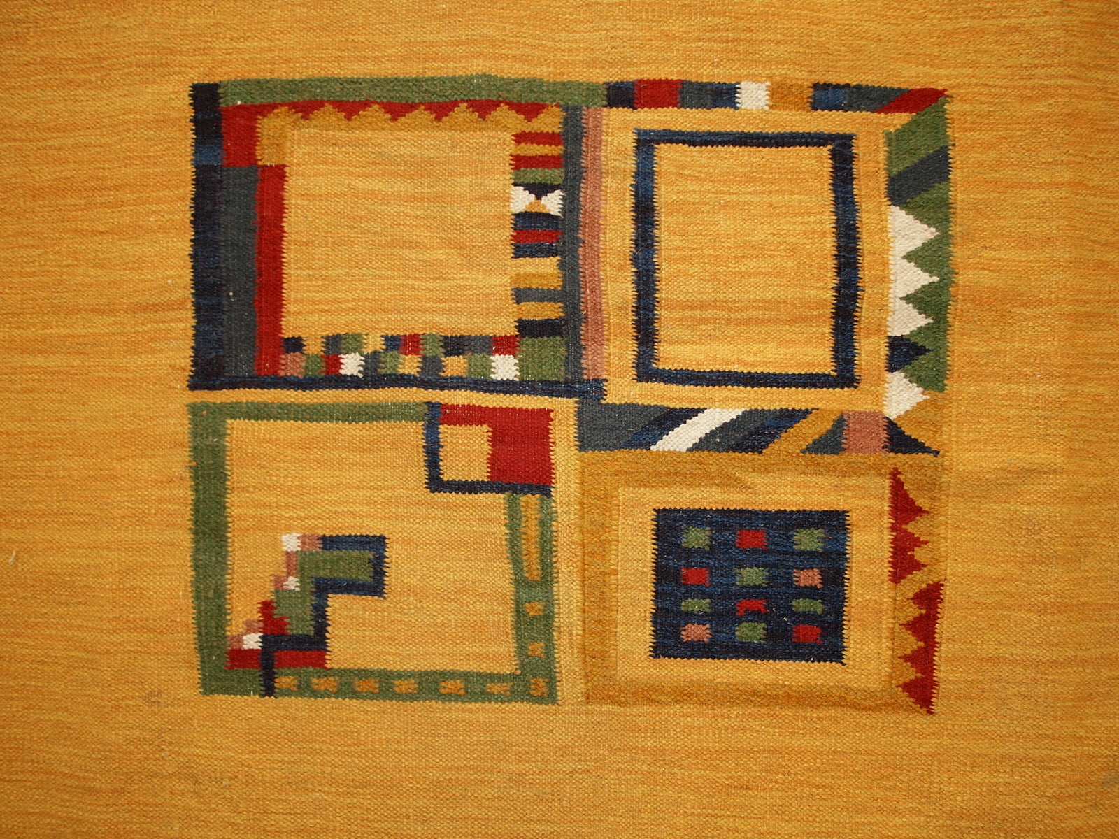 Vintage handmade Persian Gabbeh kilim in original condition. The rug is in yellow shad with minimal abstract design on it. It is made in wool.