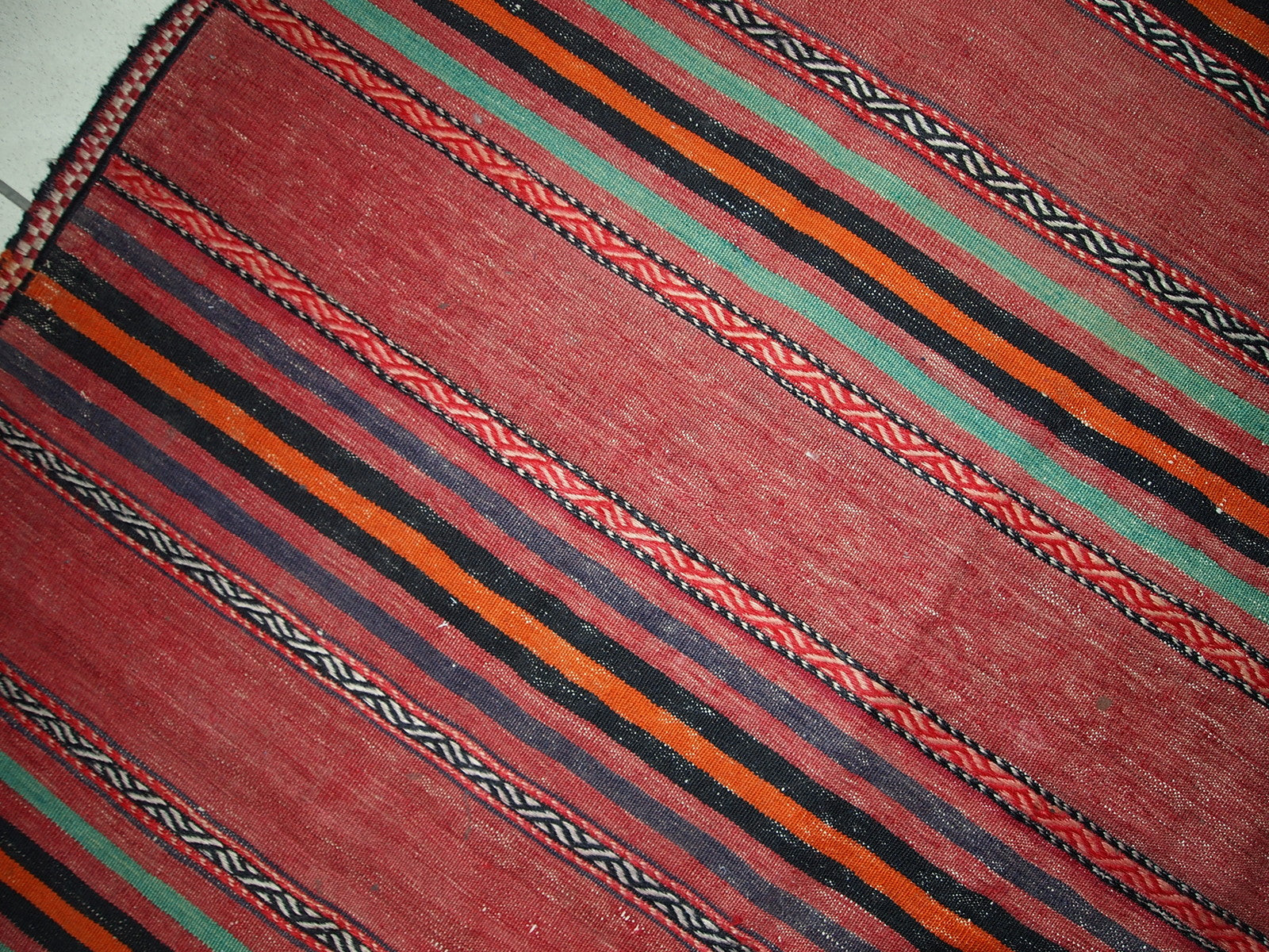 Handmade vintage Persian kilim in red shade with stripes. This kilim is in original condition, has some signs of age.