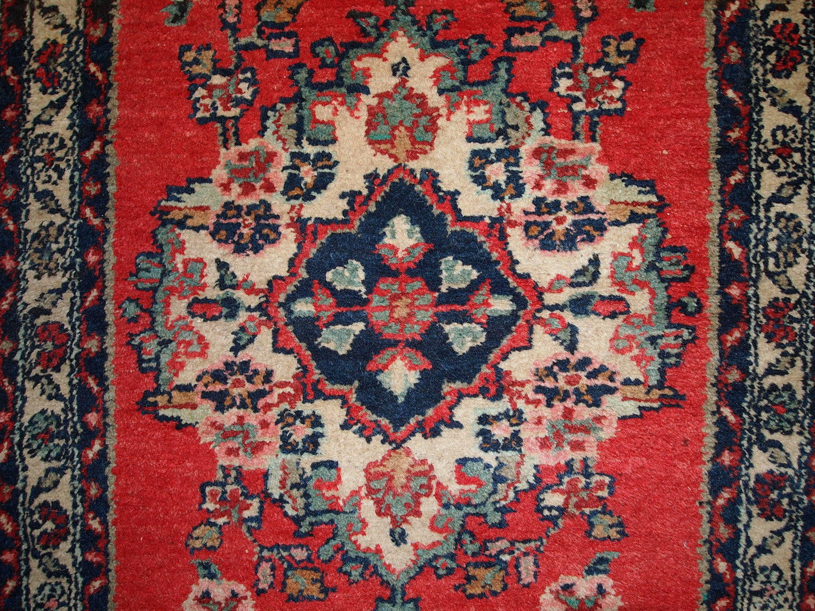 Handmade vintage Hamadan runner in red wool. This rug has been made in the middle of 20th century in Middle East region.