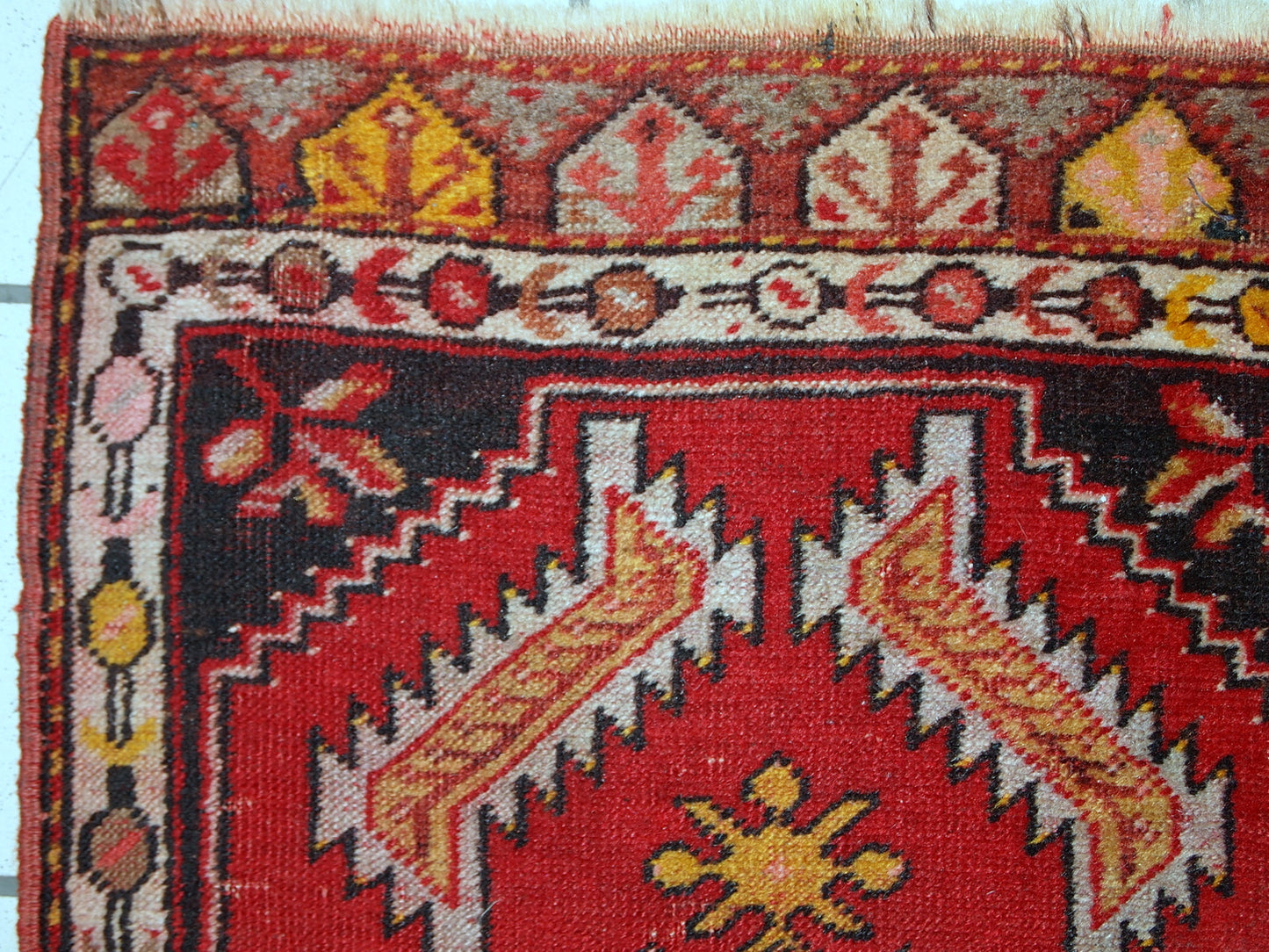 Handmade vintage Turkish Yastik rug in bright red colour. The rug is in original good condition from the middle of 20th century.