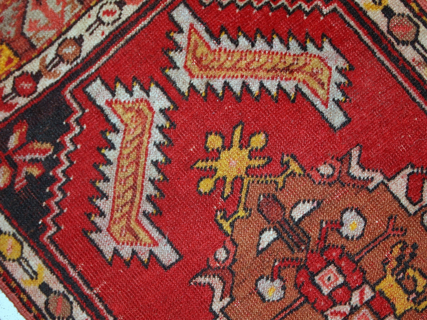 Handmade vintage Turkish Yastik rug in bright red colour. The rug is in original good condition from the middle of 20th century.