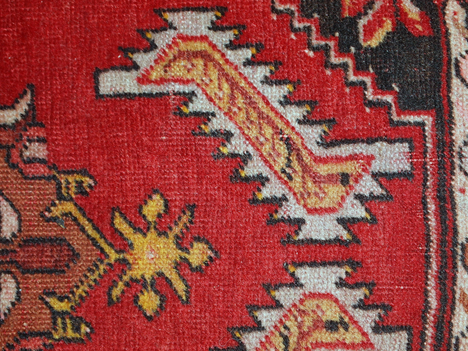 Handmade vintage Turkish Yastik rug in bright red colour. The rug is in original good condition from the middle of 20th century.