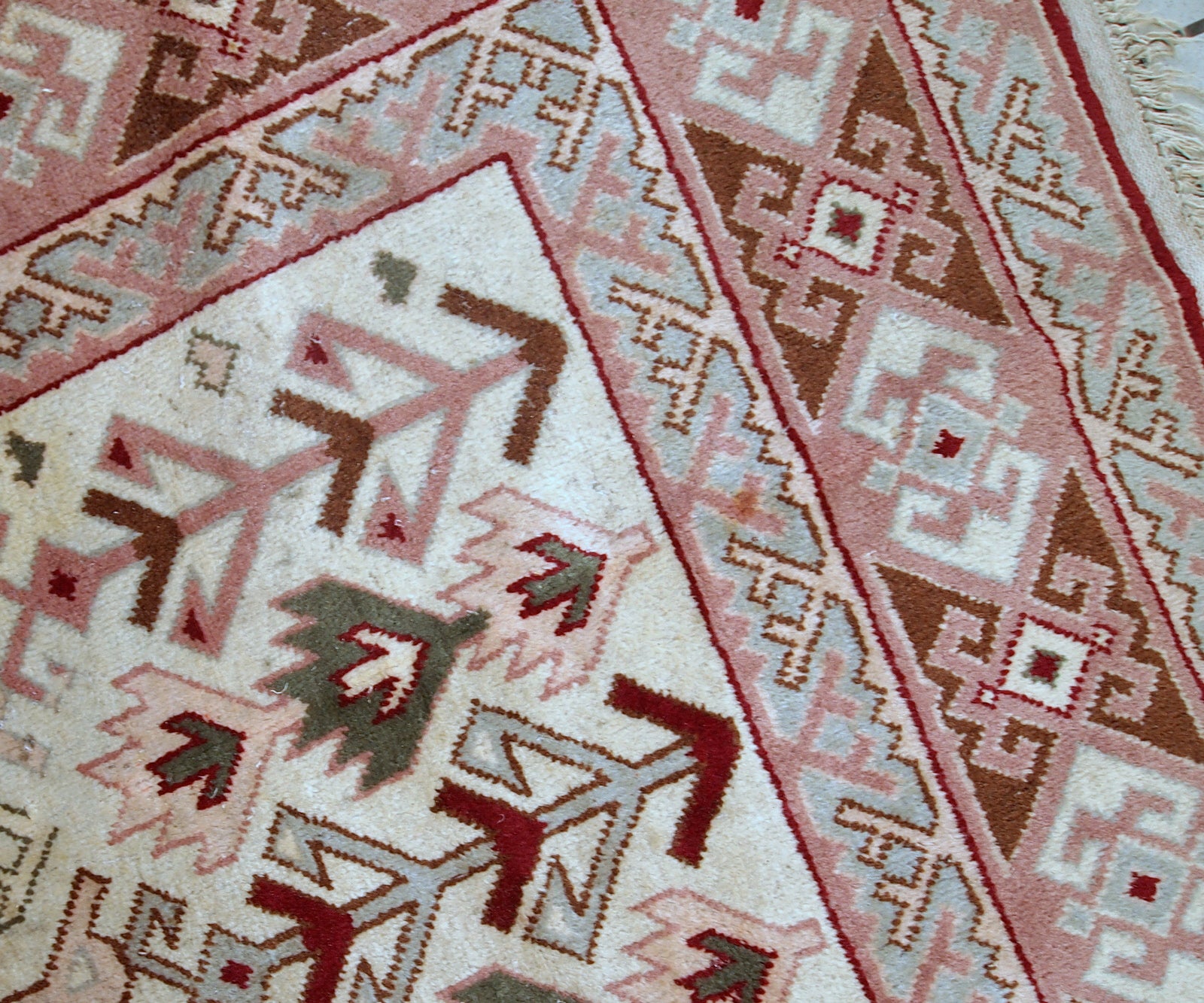 Handmade vintage Turkish Sivas rug in geometric design. The rug is in original condition, from the middle of 20th century. The rug has some age discolorations.