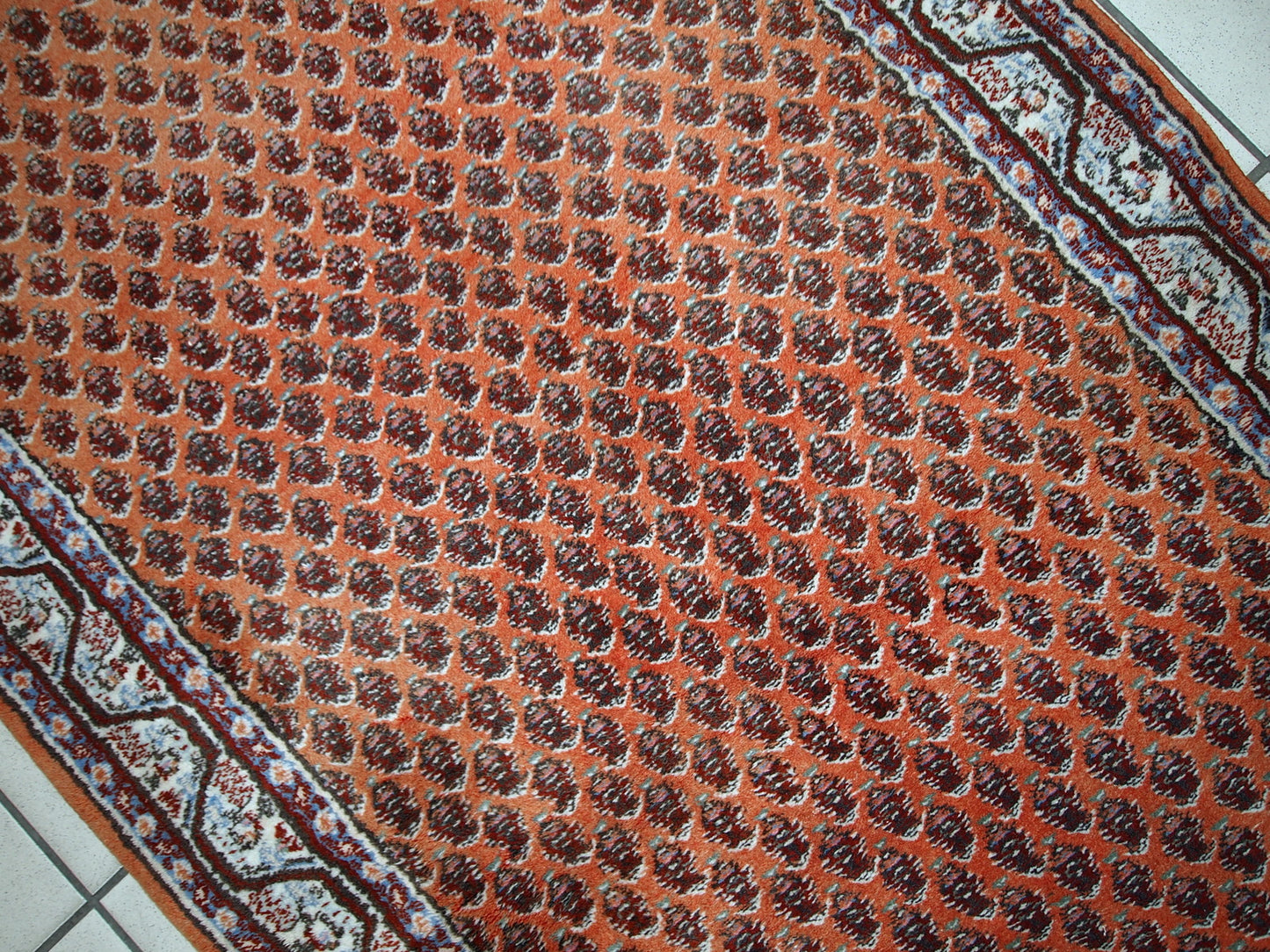 Handmade vintage Seraband rug from India, made in the end of 20th century. The rug is in original good condition. It has been made in traditional all-over design.