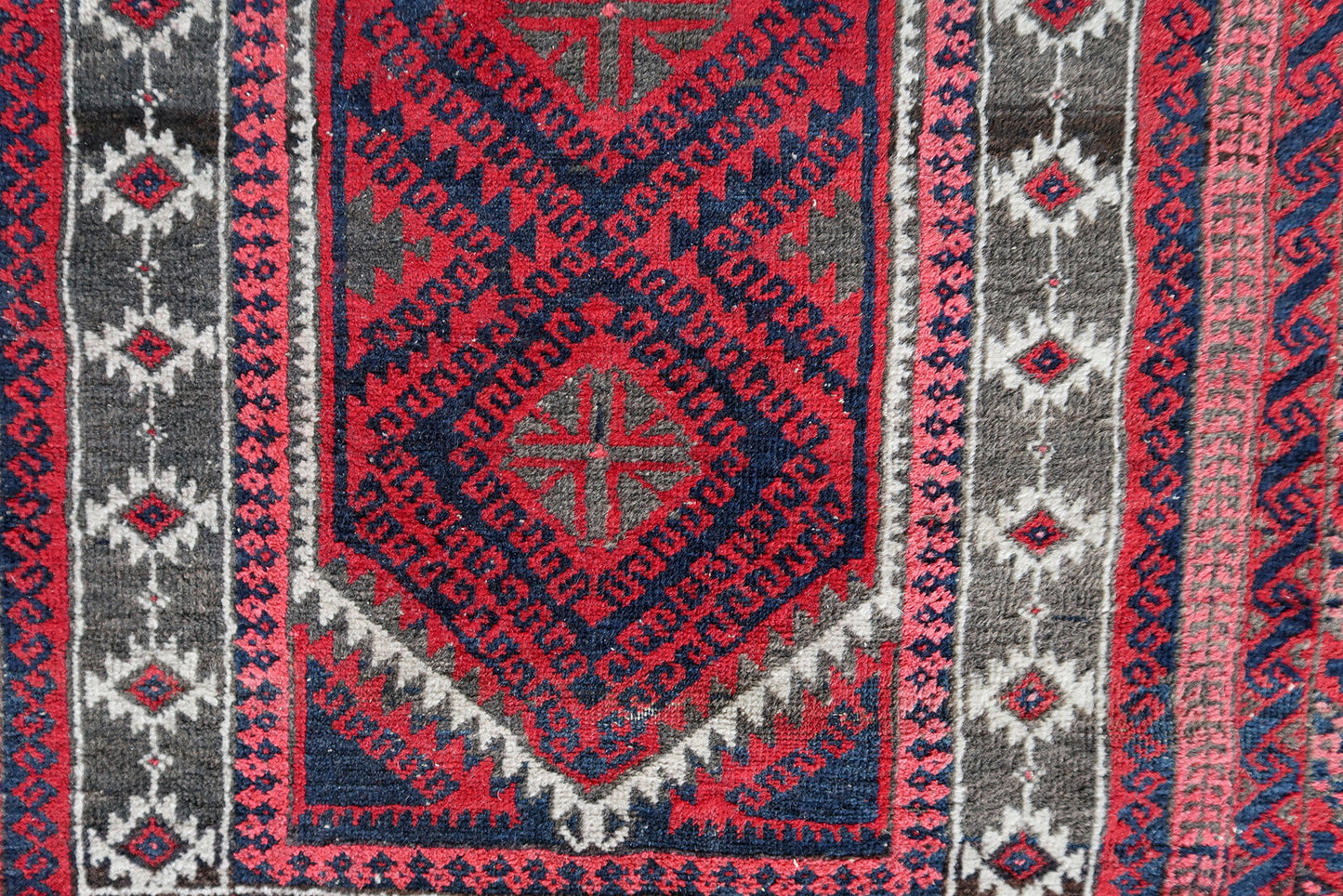 Handmade vintage Afghan Baluch rug in red and night blue colors. The rug is from the beginning of 20th century, it is in original good condition. This rug is prayer.