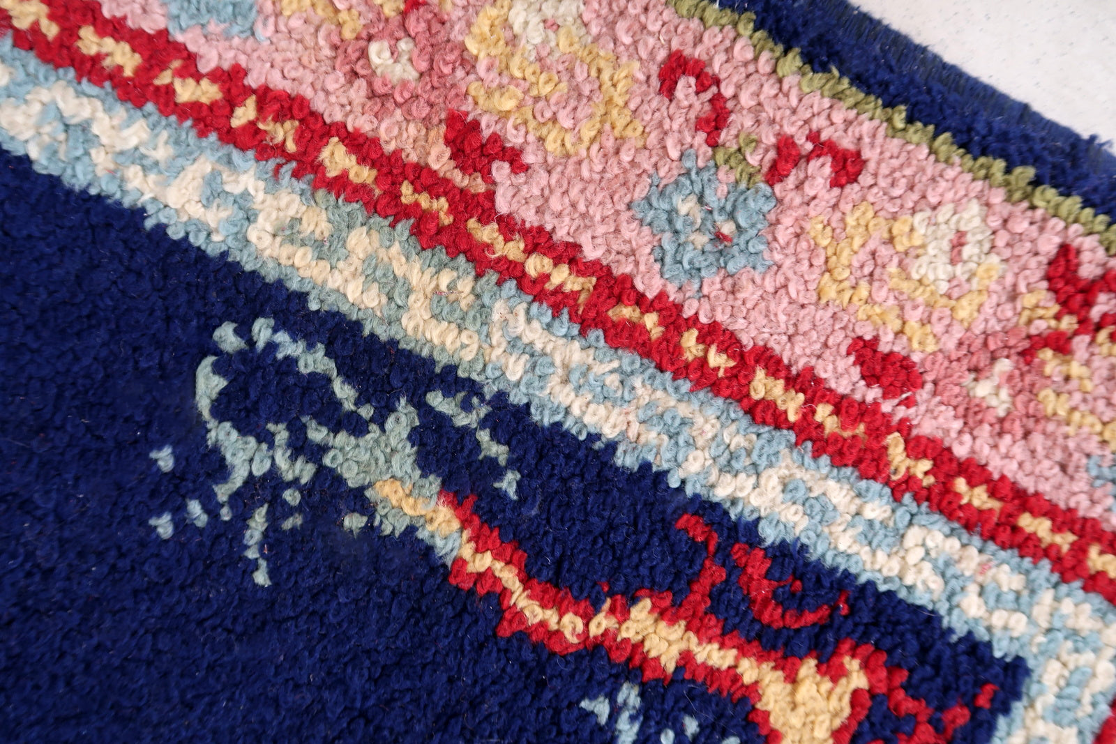 Vintage French Savonnerie rug in night blue and pink colors. The rug has been made in wool in the end of 20th century. It is in original good condition. The rug has dragon design.