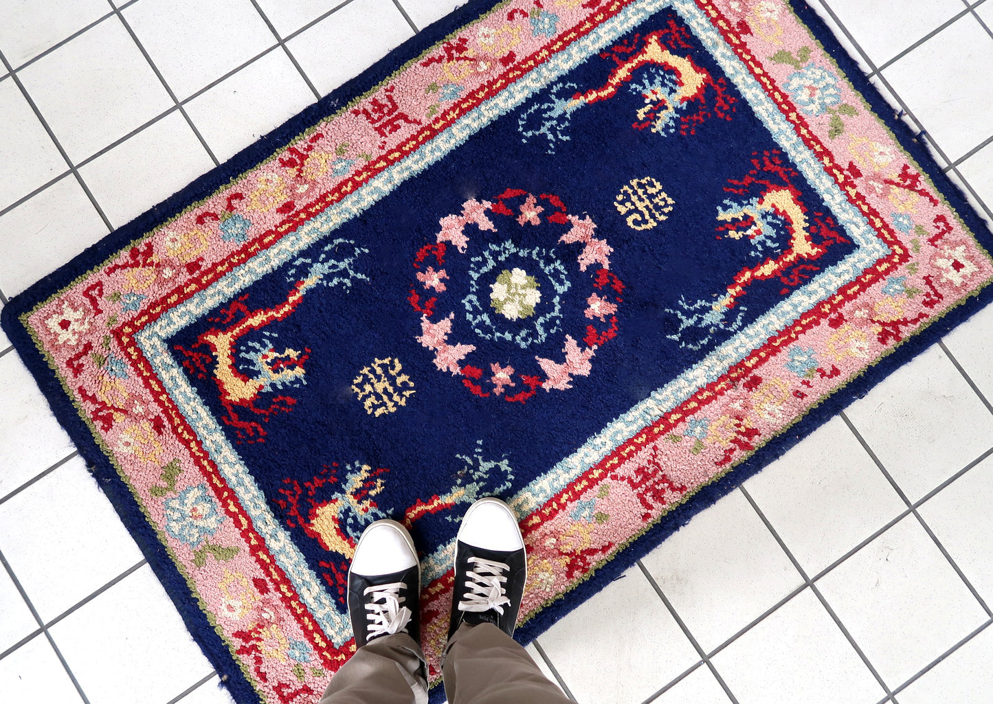 Vintage French Savonnerie rug in night blue and pink colors. The rug has been made in wool in the end of 20th century. It is in original good condition. The rug has dragon design.