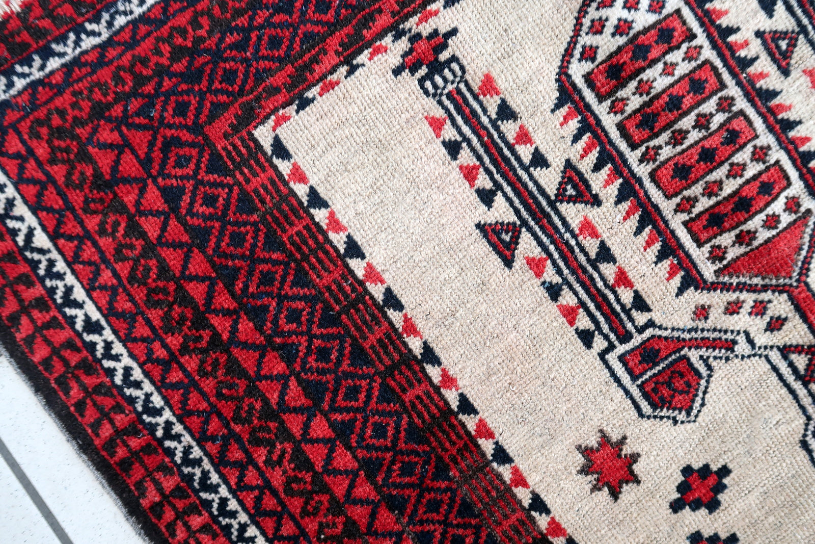 Handmade antique Afghan rug from Baluchi region. This prayer rug made in the beginning of 20th century, it is in original condition, has some low pile. 