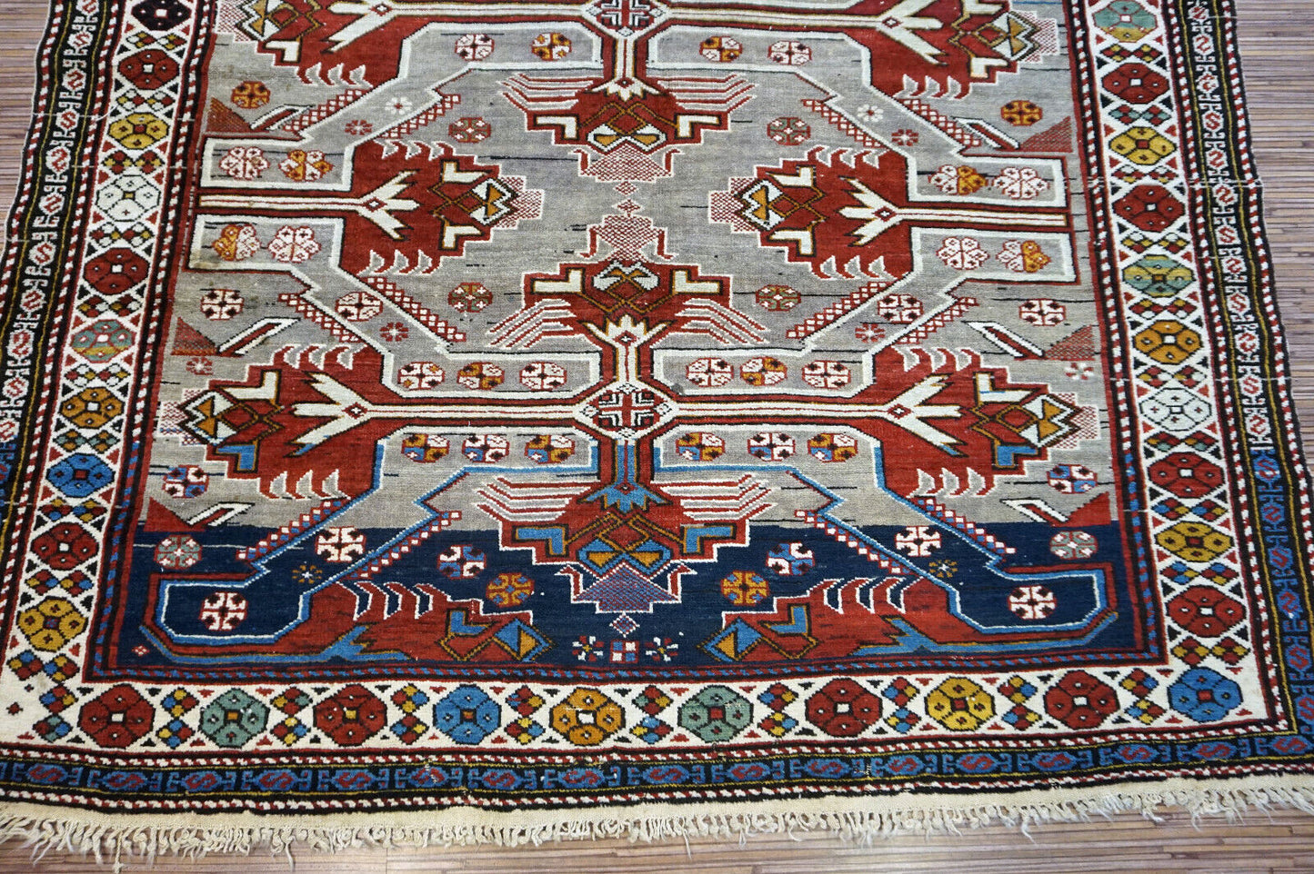 Handmade vintage Caucasian Shirvan rug in unusual cross design. The rug is from the middle of 20th century in original good condition.