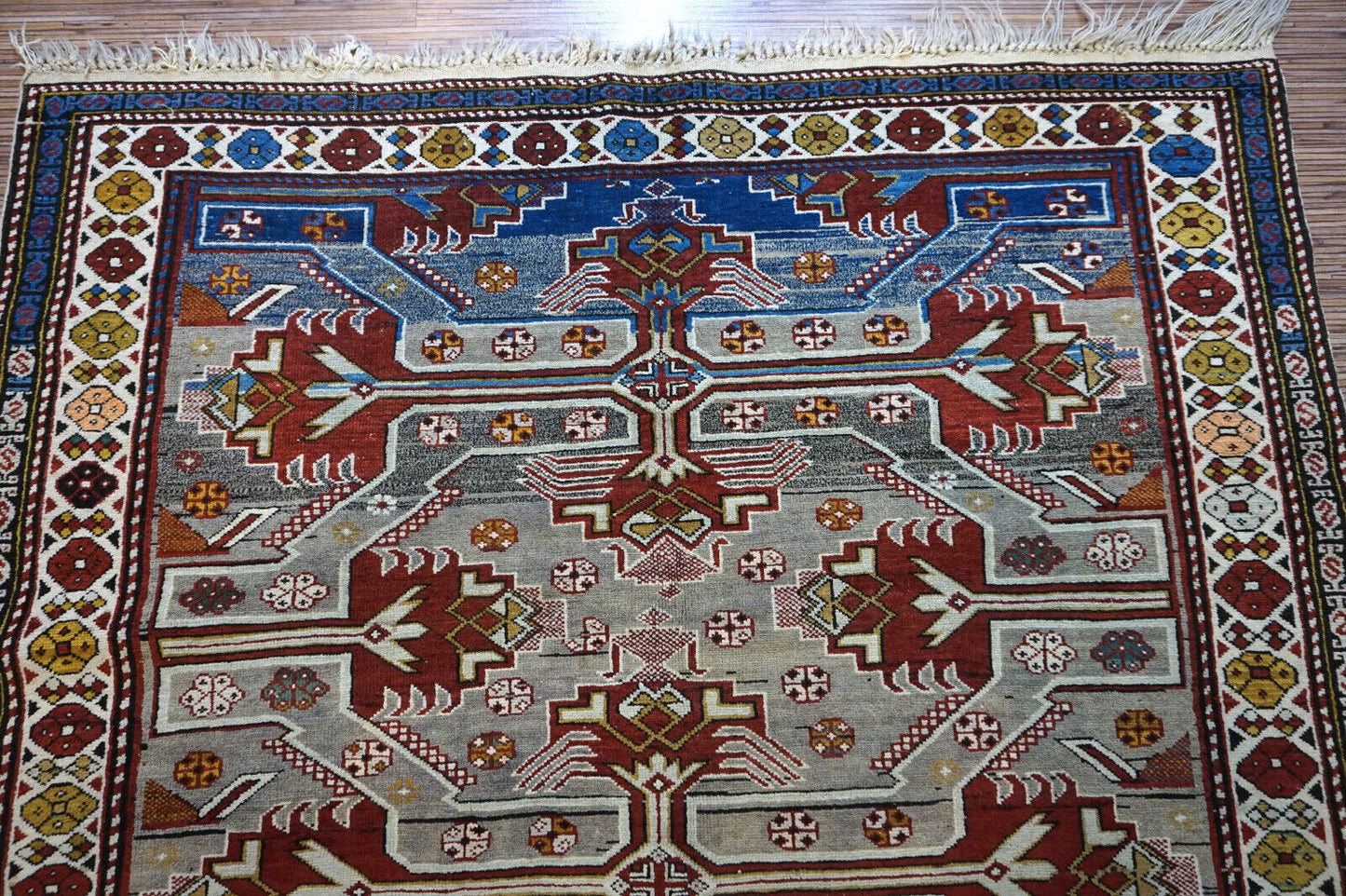 Handmade vintage Caucasian Shirvan rug in unusual cross design. The rug is from the middle of 20th century in original good condition.